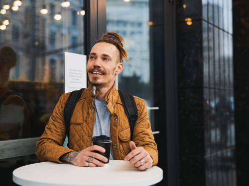 Someone is enjoying a cup of coffee at a café.
