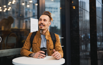 Someone is enjoying a cup of coffee at a café.